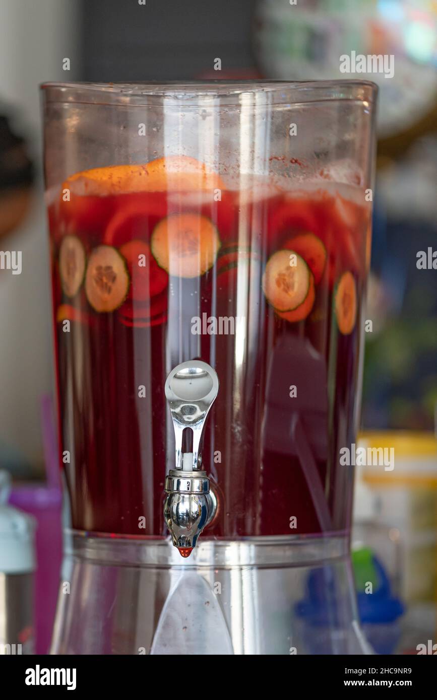 fruit punch in a drink dispenser at a party Stock Photo - Alamy