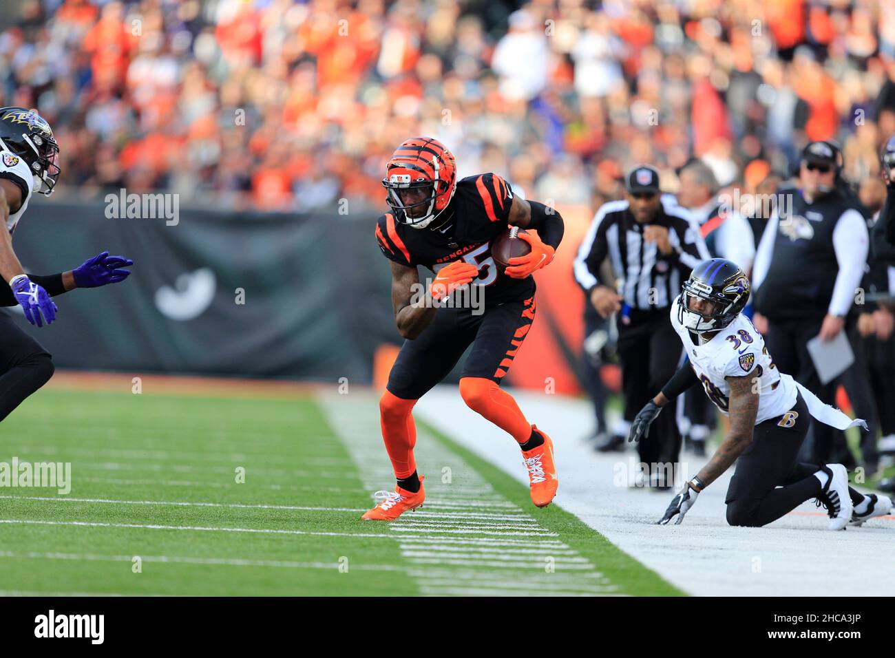 Cincinnati Bengals wide receiver Tee Higgins (85) leaps to make a catch  during an NFL football game against the Los Angeles Chargers, Sunday, Dec.  5, 2021, in Cincinnati. (AP Photo/Zach Bolinger Stock