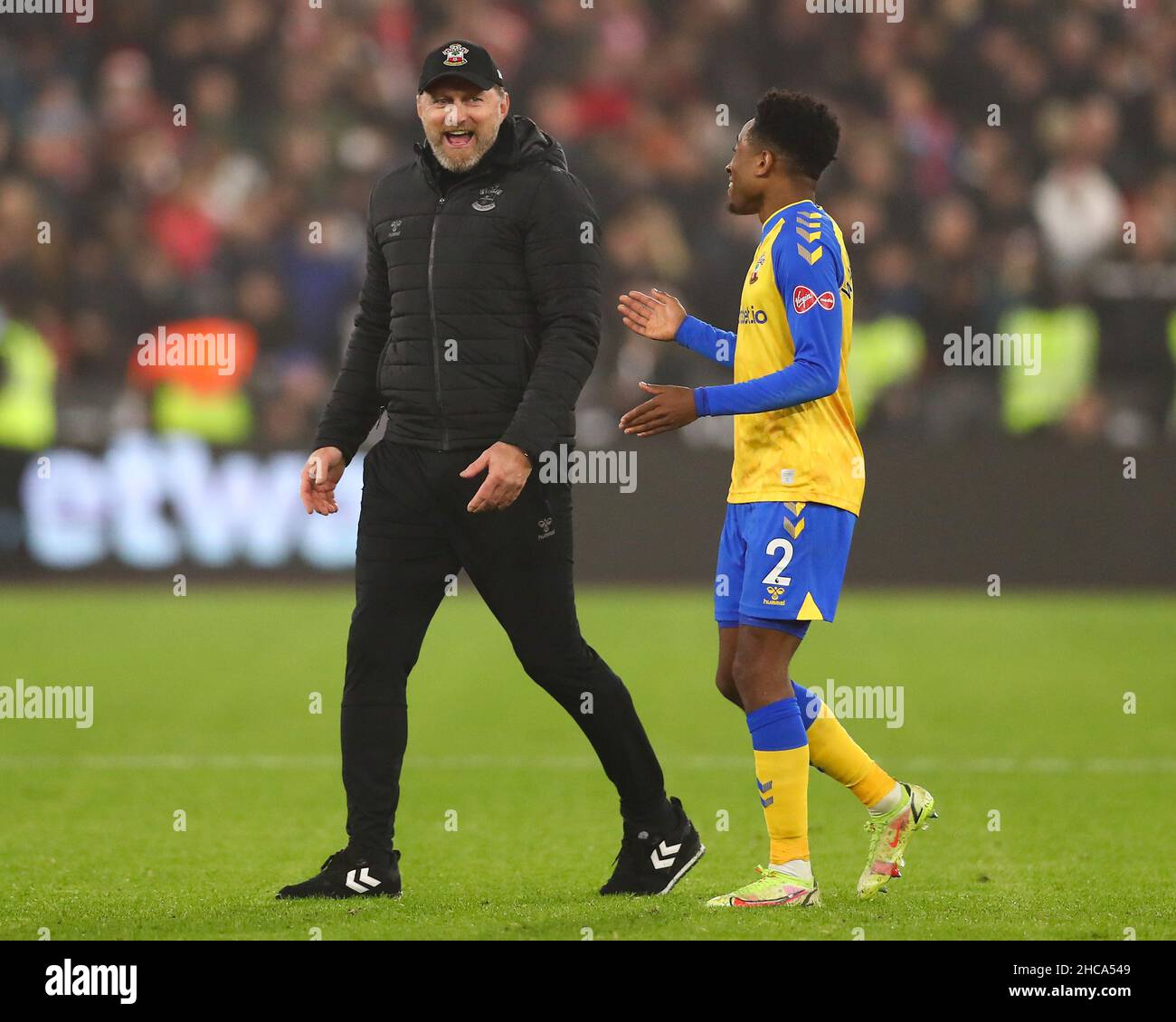 London, England, 26th December 2021.  Ralph Hasenhuettl, Manager of Southampton interacts with Kyle Walker-Peters of Southampton  during the Premier League match at the London Stadium, London. Picture credit should read: Jacques Feeney / Sportimage Credit: Sportimage/Alamy Live News Stock Photo
