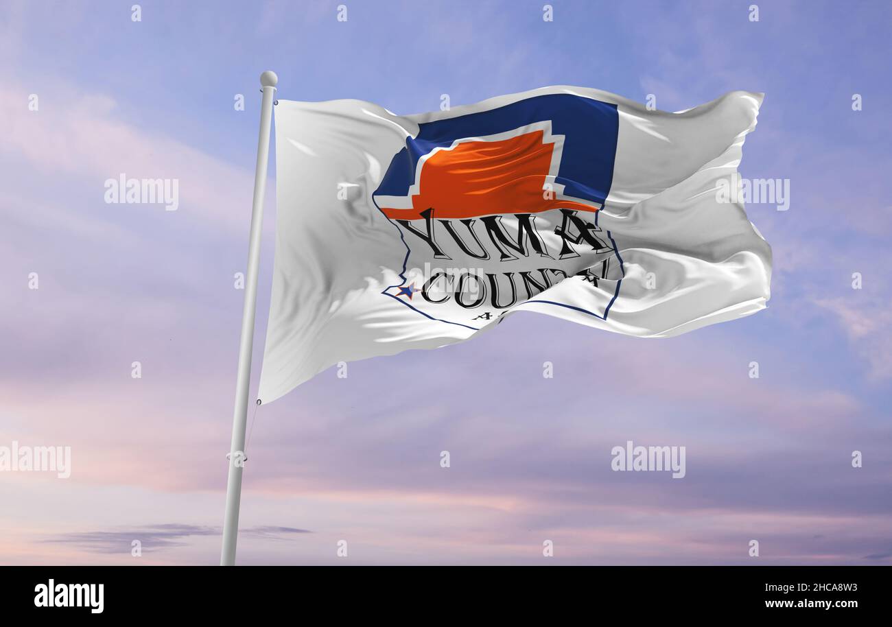 flag of county Yuma, Arizona , USA at cloudy sky background on sunset