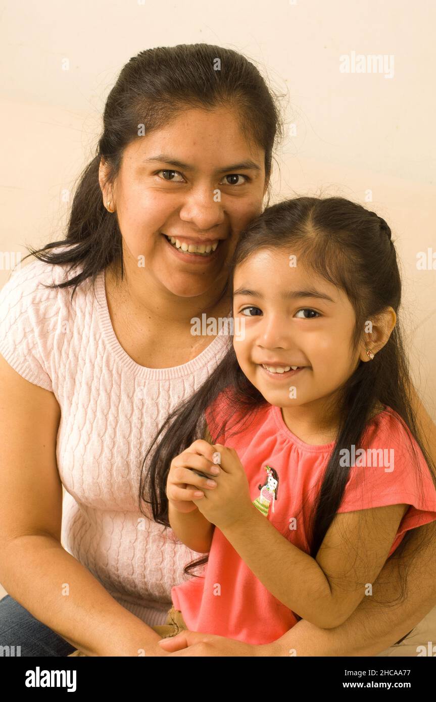 3 year old girl portrait with her mother Mexican American Stock Photo