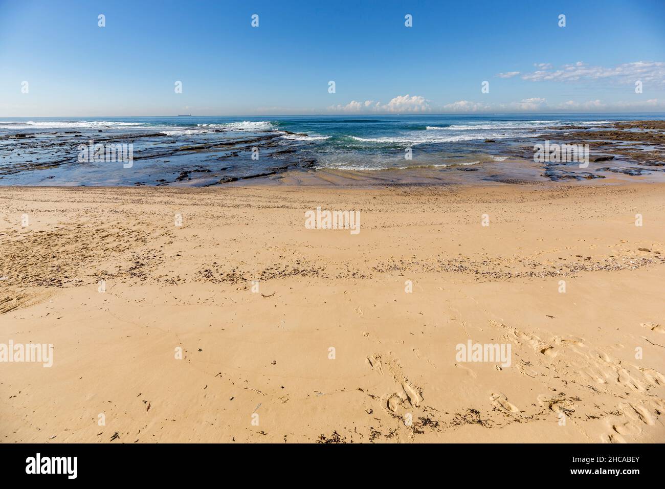 Beautiful view of a beach with splashing waves Stock Photo - Alamy