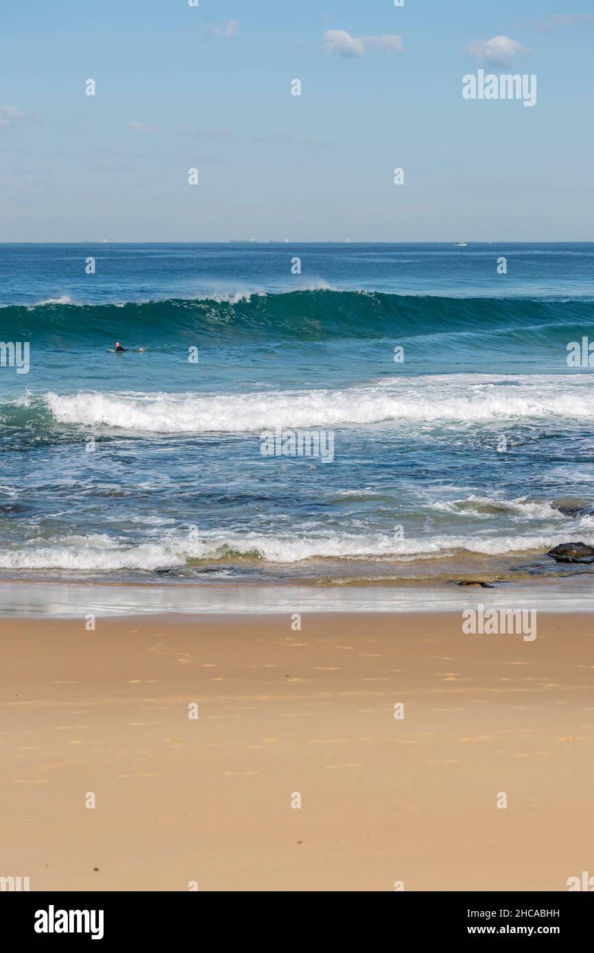 Beautiful view of a beach with splashing waves Stock Photo - Alamy