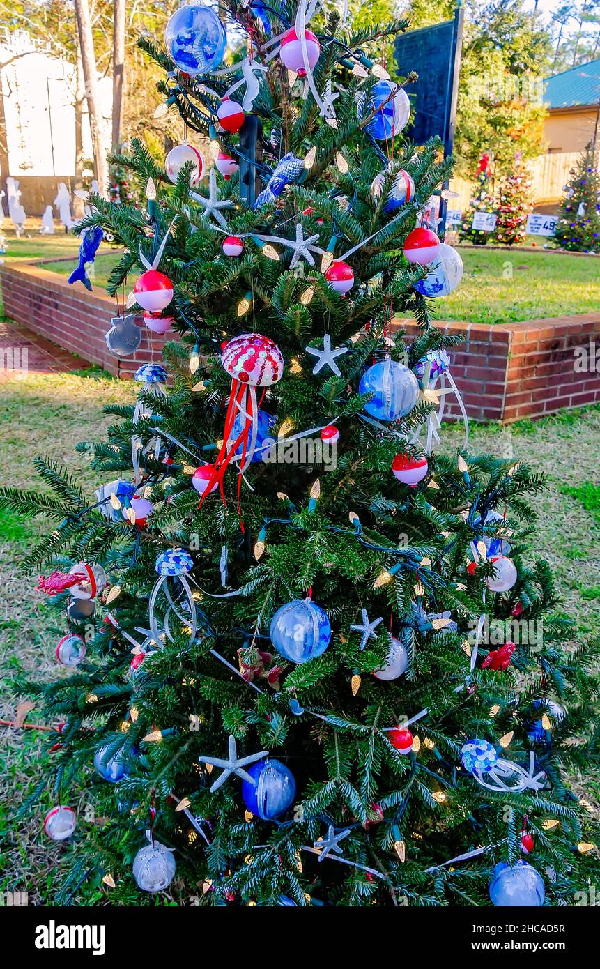 A Christmas tree features an aquatic theme with homemade jellyfish ornaments at Water Tower Plaza, Dec. 24, 2021, in Dauphin Island, Alabama. Stock Photo