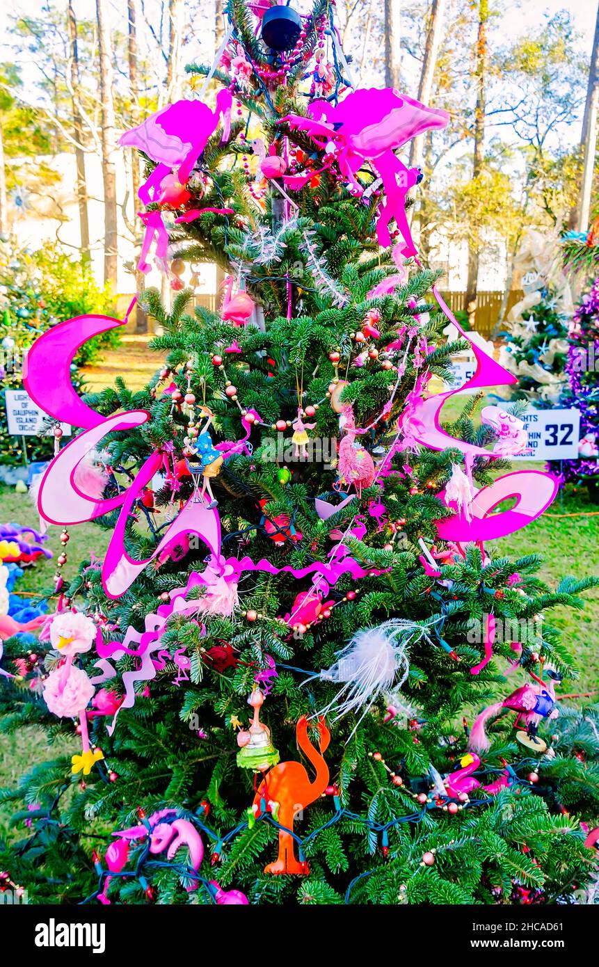 A Christmas tree features a pink flamingo tropical theme at Water Tower Plaza, Dec. 24, 2021, in Dauphin Island, Alabama. Stock Photo