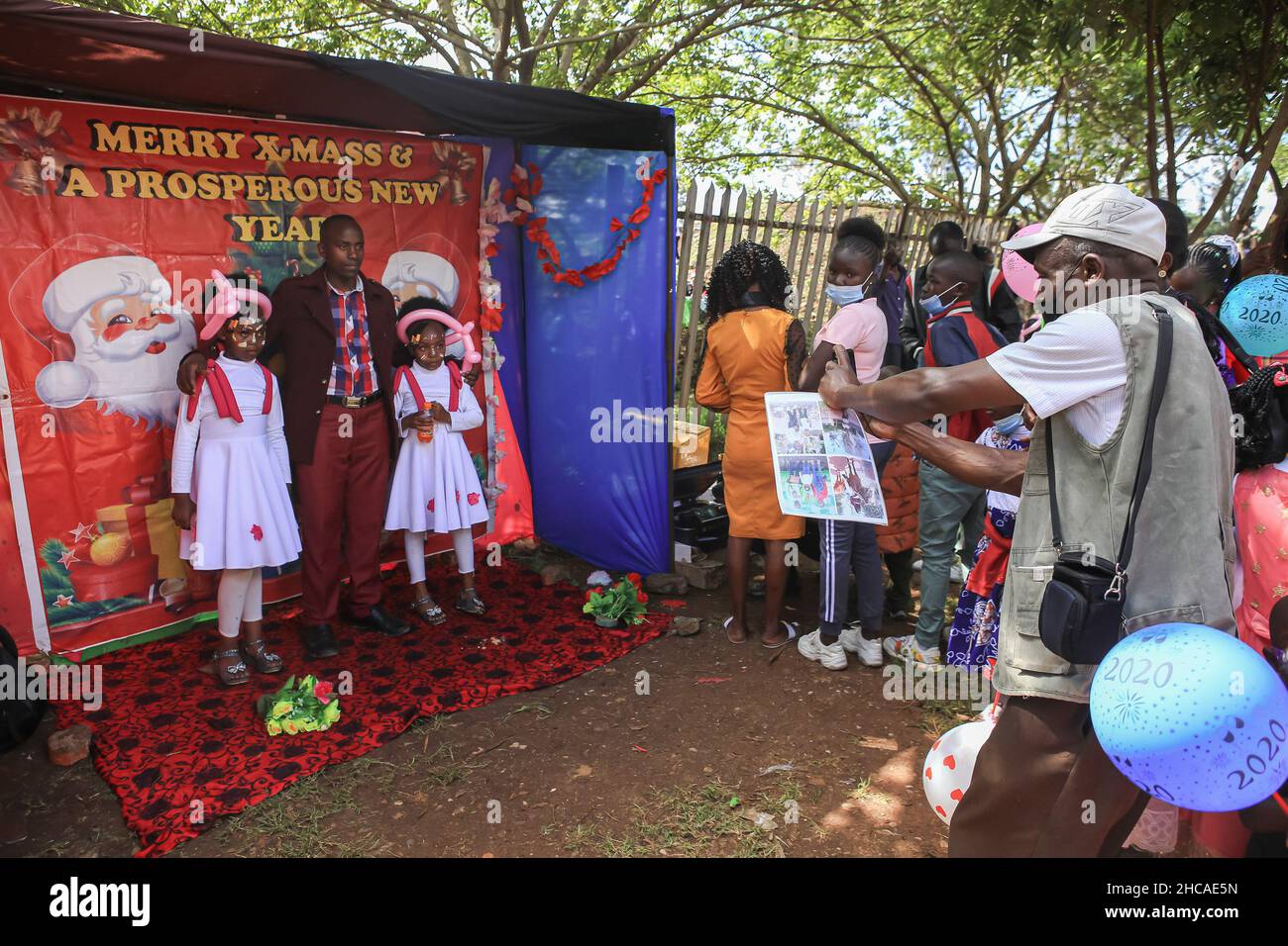 Nairobi, Kenya. 25th Dec, 2021. A photographer takes photos of a family