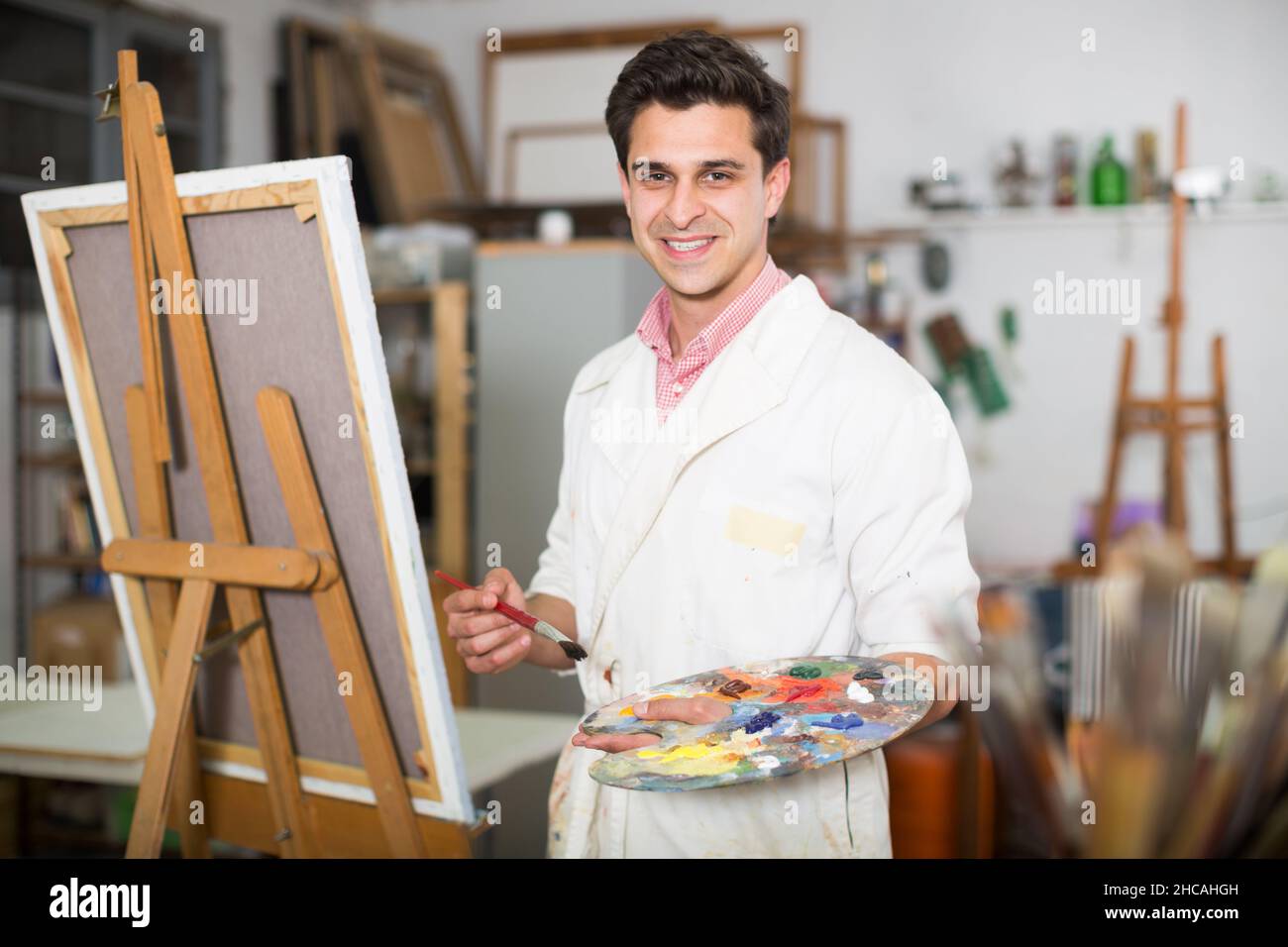 Artist painting on canvas Stock Photo Alamy
