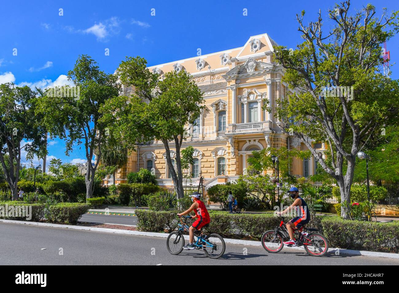 People biking on the Bicycle Route on Paseo de Montejo (closed to traffic) on Sunday , Merida Mexico Stock Photo