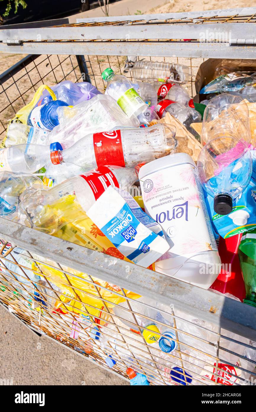 Empty plastic bottles in a separatewaste container. Almaty, Kazakhstan