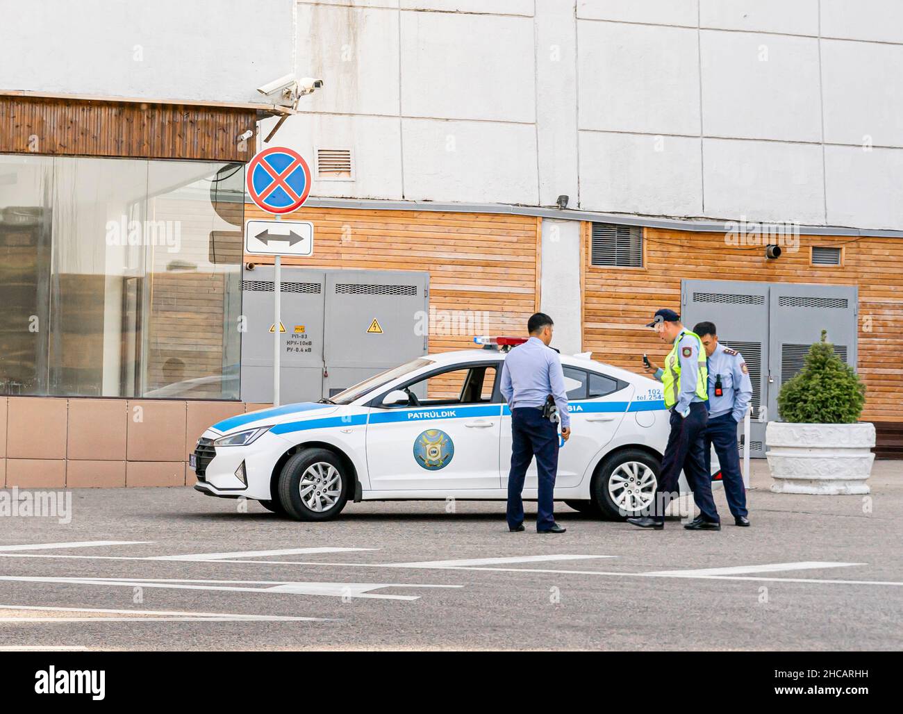 Kazakh policemen beside polisia patrol vehicle car, Almaty, Kazakhstan Stock Photo Alamy