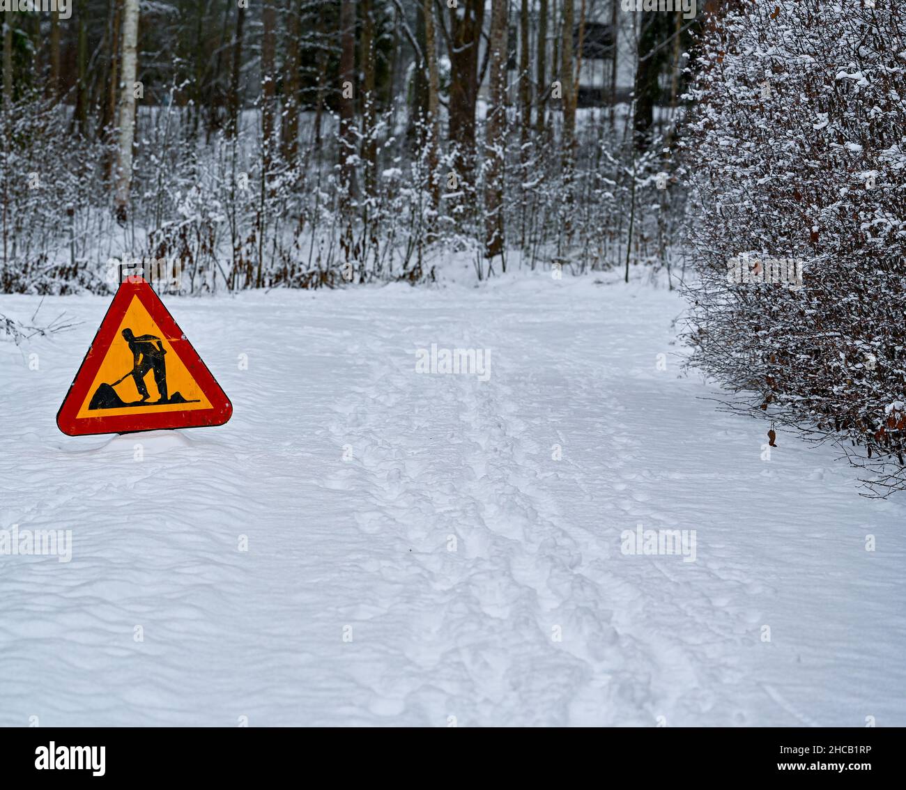 A sign of a man with a shovel. Caution, road works are under way Stock  Photo - Alamy