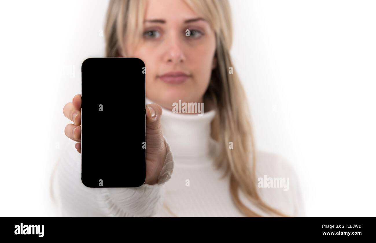 Woman shows smartphone blank hi-res stock photography and images - Alamy