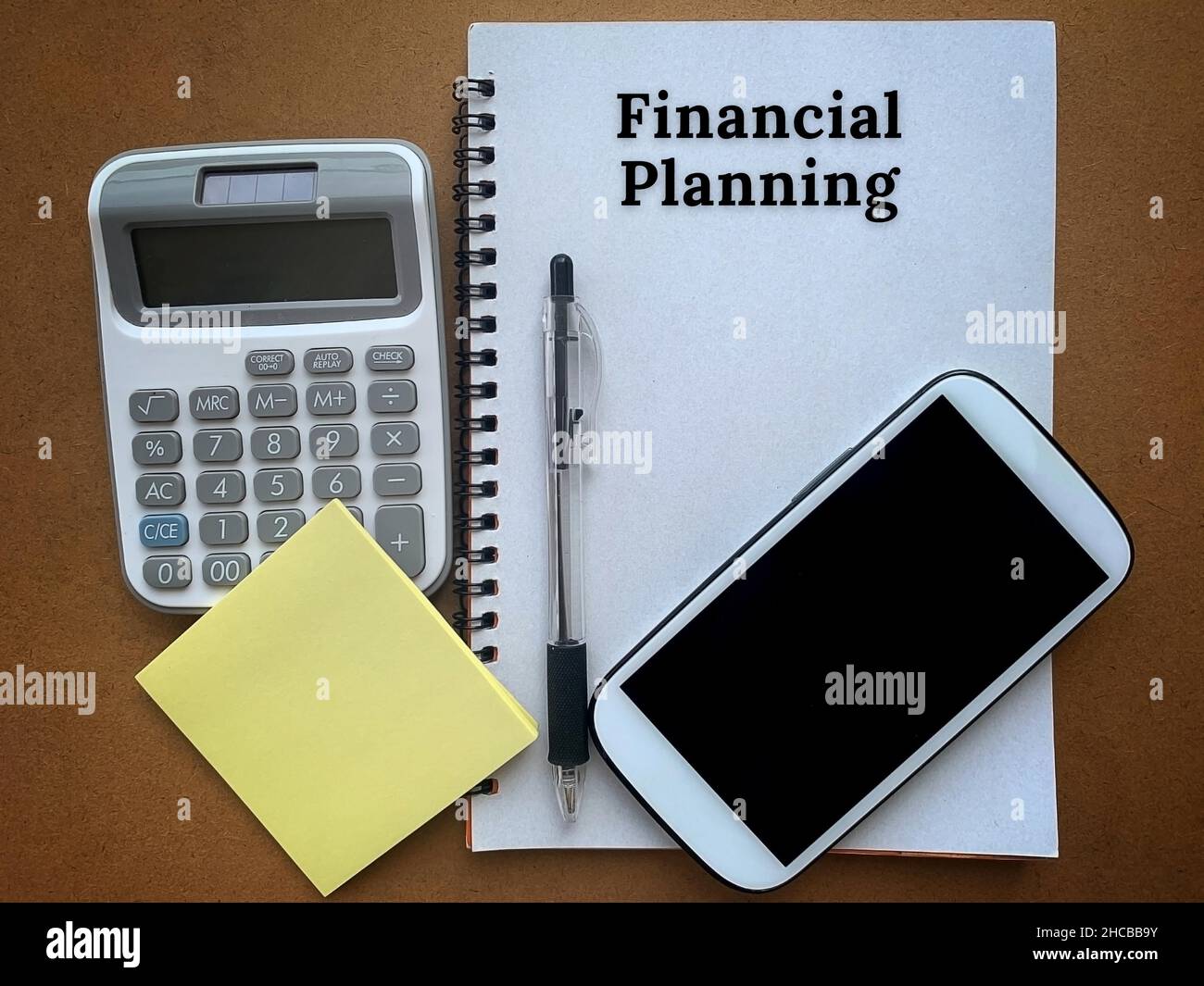 Financial Note Images Financial planning text on a notepad with smart phone, pen, calculator ...
