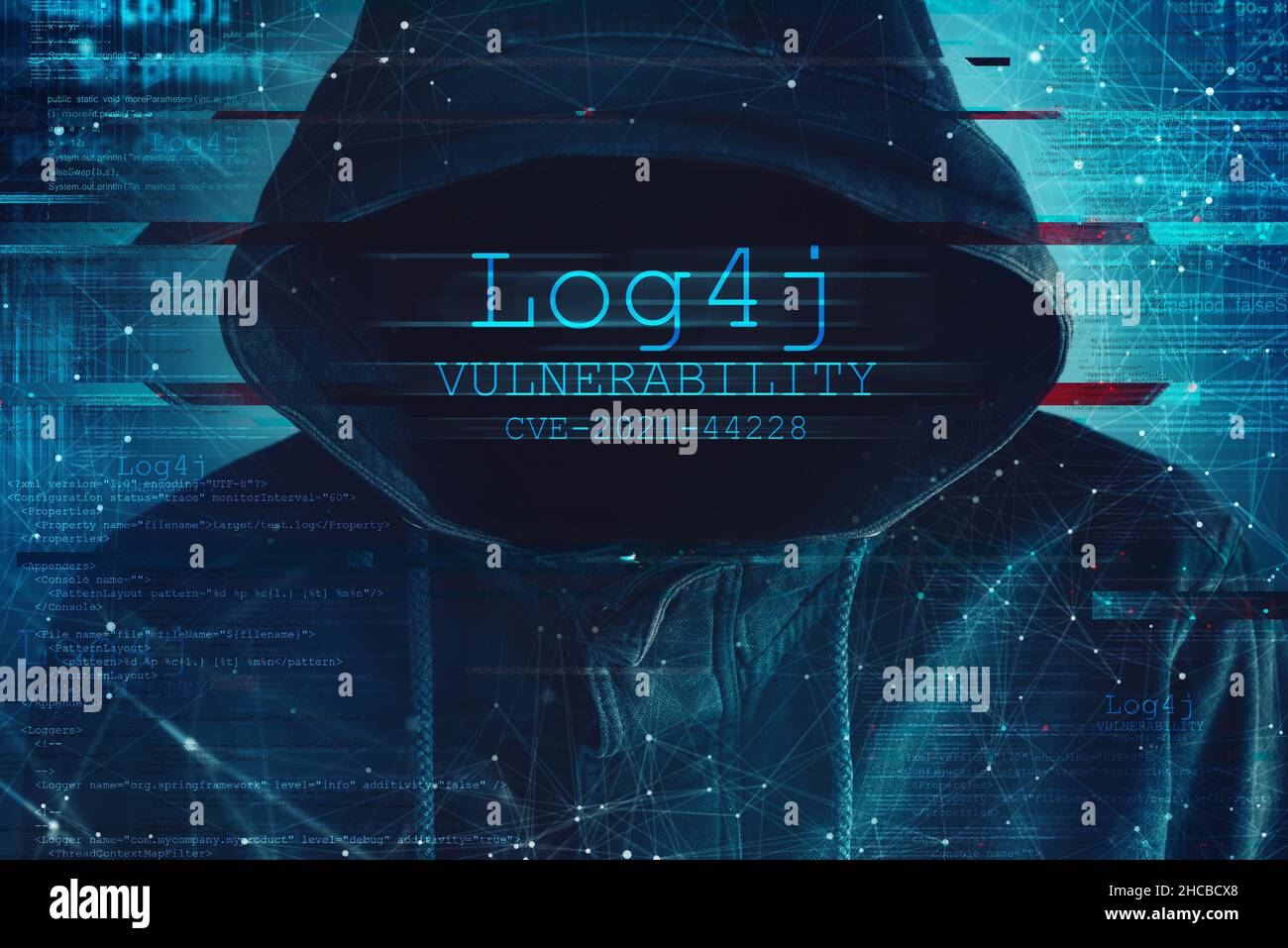 Hooded computer hacker in cybersecurity vulnerability Log4J concept with digital glitch effect Stock Photo