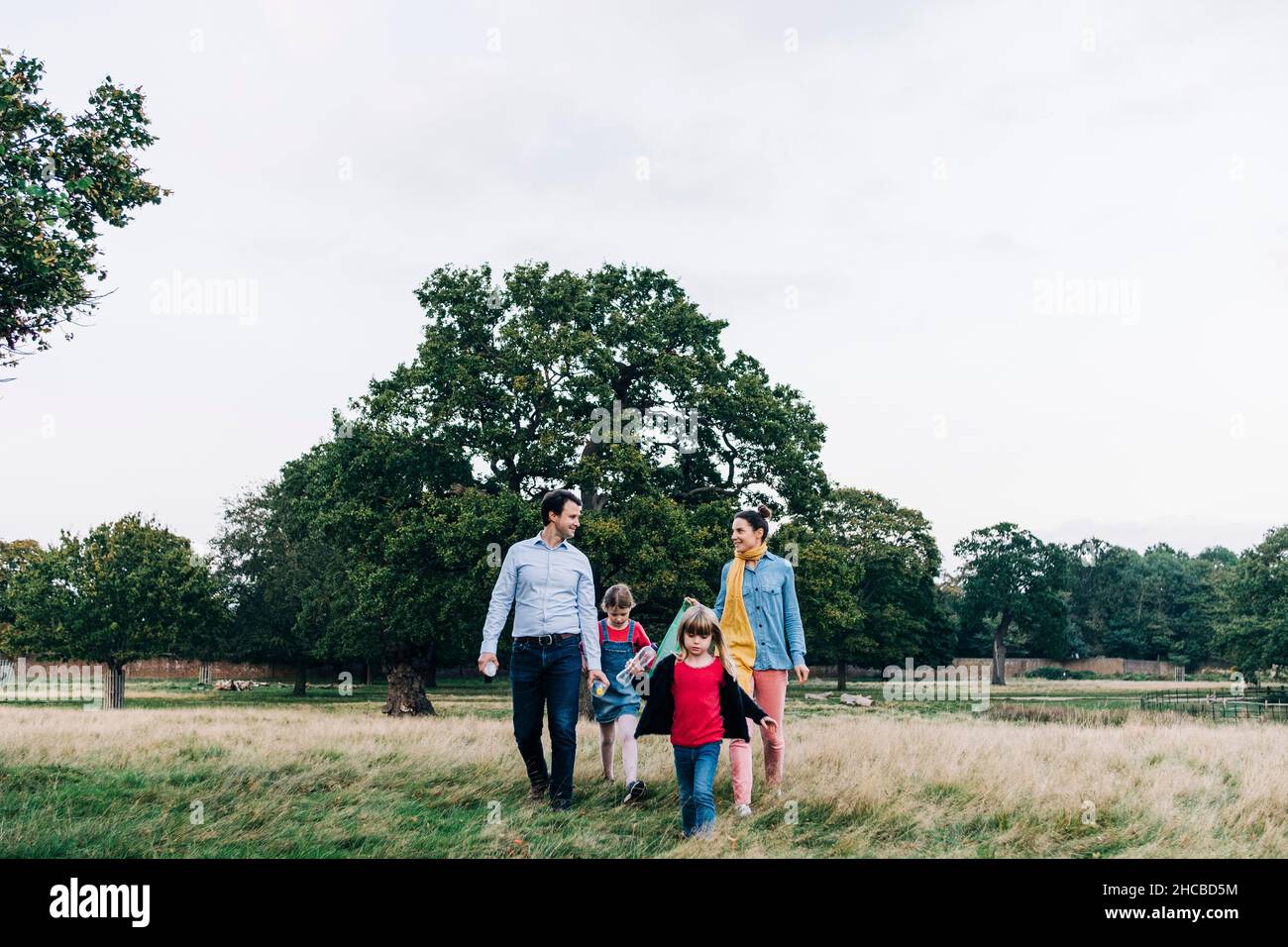 Family doing cleanup together in public park Stock Photo