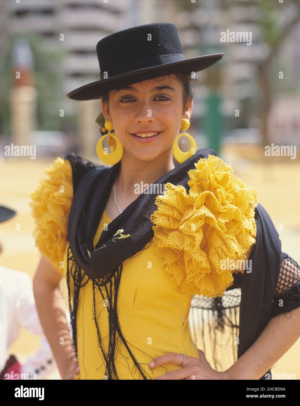 Spain. Andalusia region. Cádiz. The Jerez Horse Fair. Young woman in traditional clothes. Stock Photo