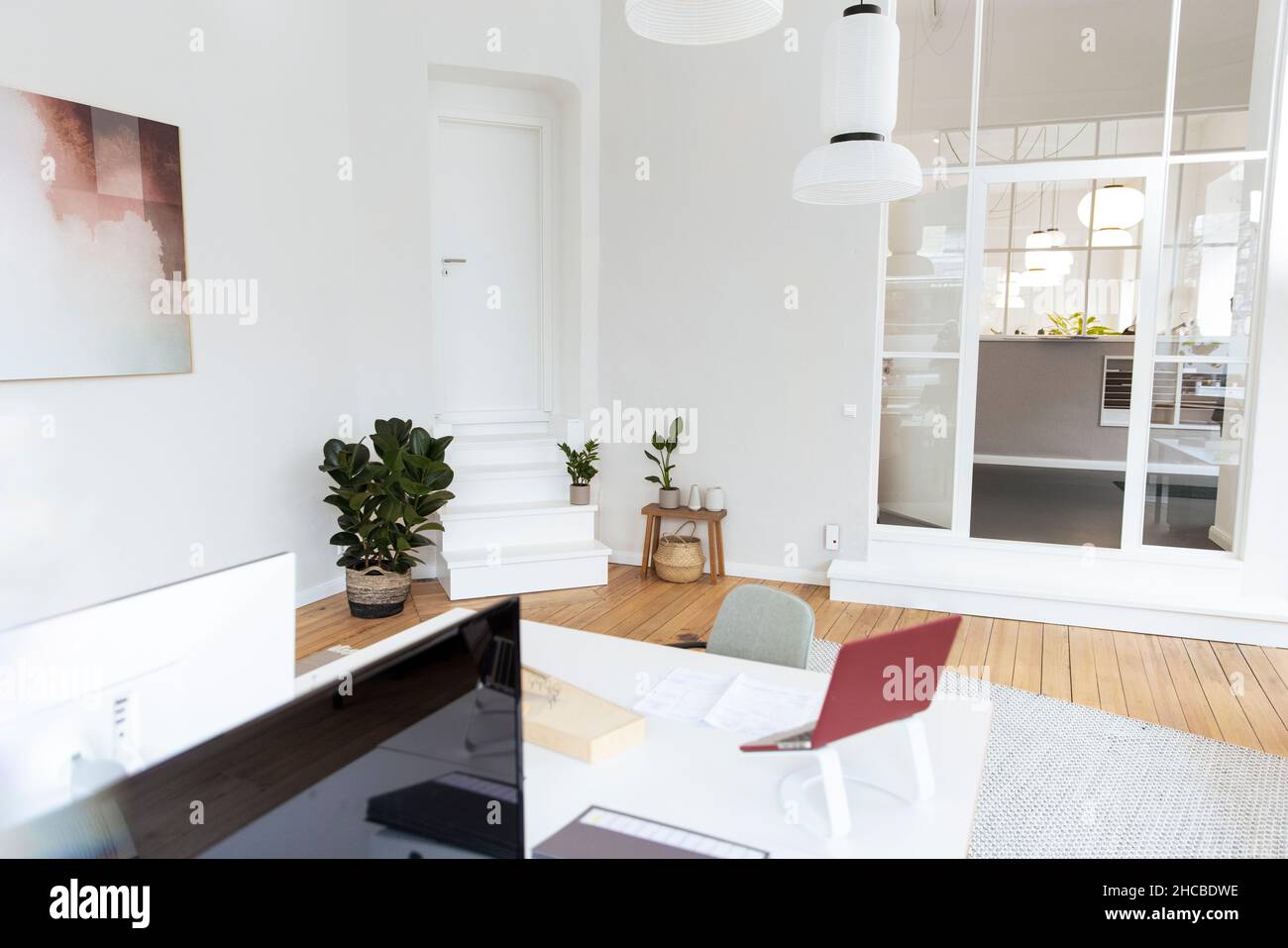 Pendant lights over desk in office Stock Photo Alamy