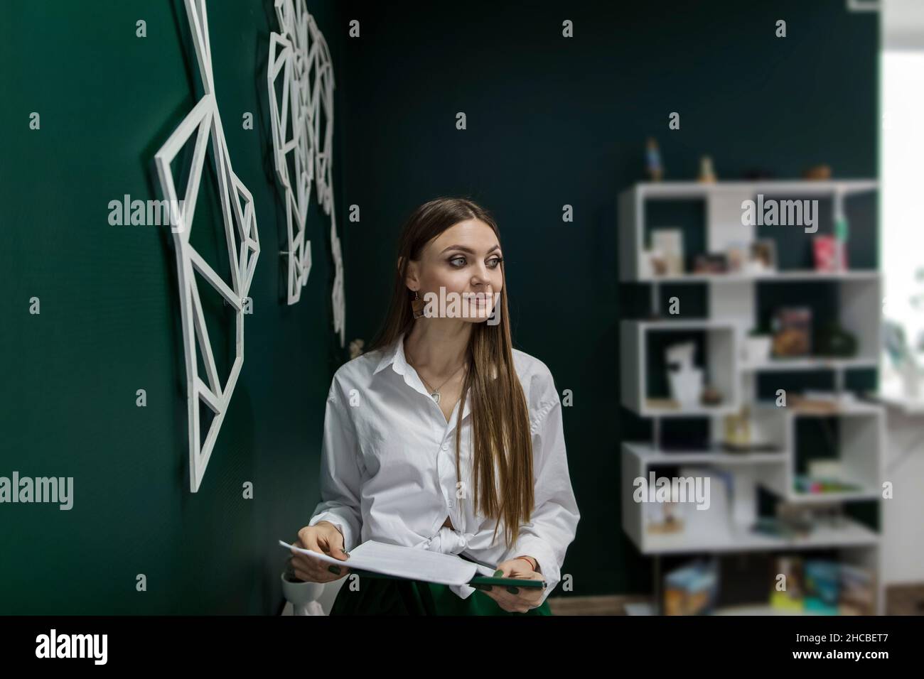 Saleswoman with documents in office Stock Photo