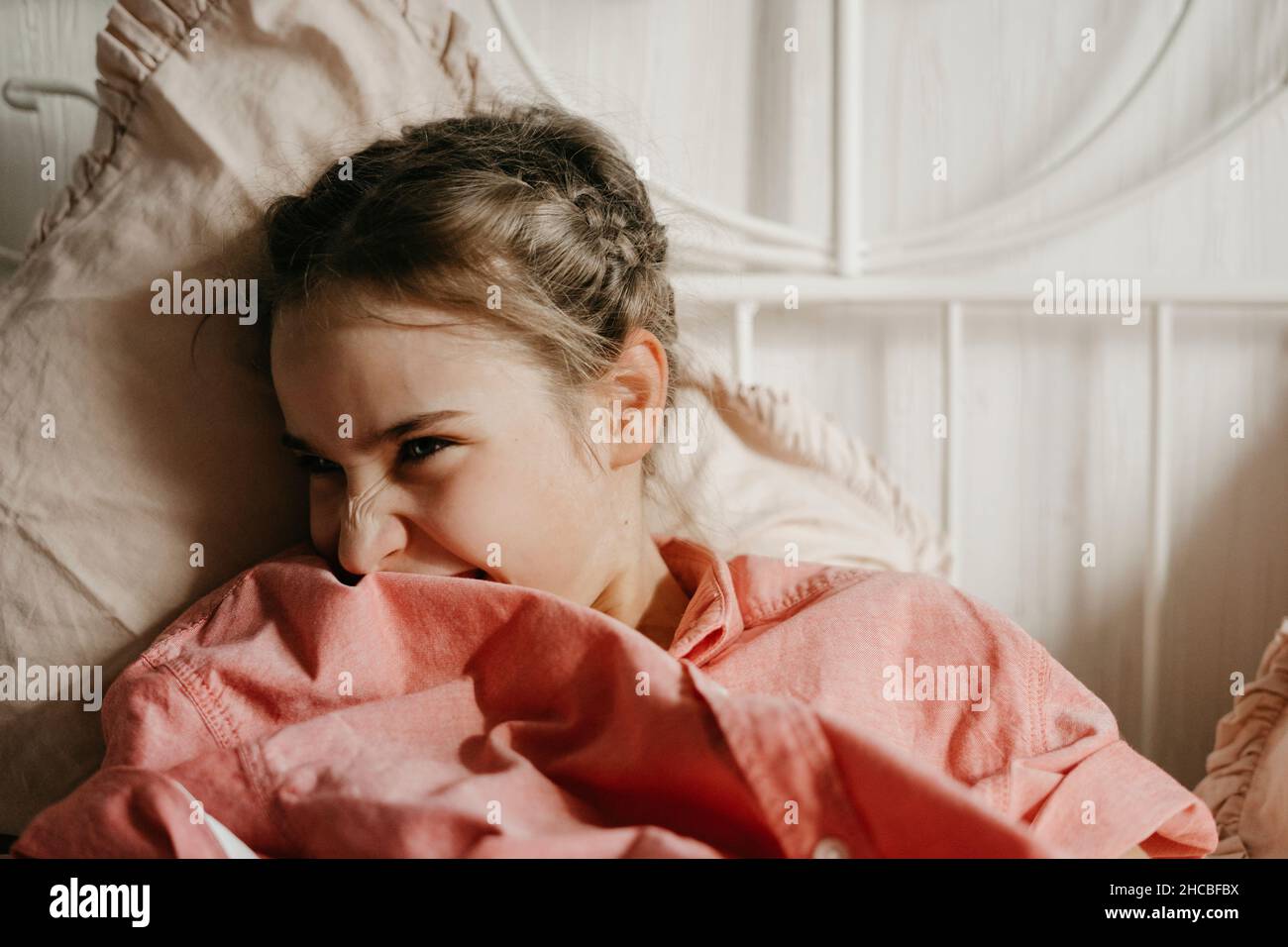Playful girl on bed hi-res stock photography and images - Alamy