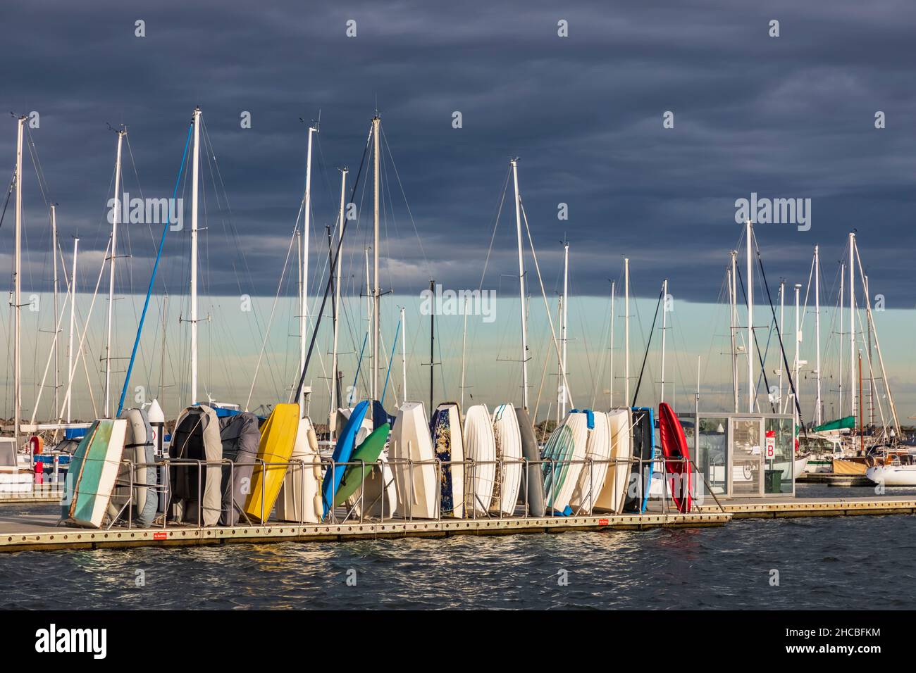 Australia, Victoria, Melbourne, Cloudy sky over yachts floating against city skyline Stock Photo