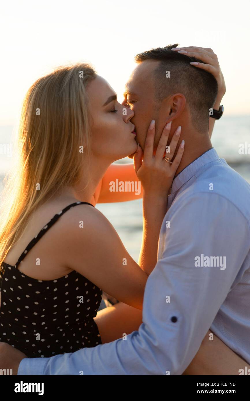 Woman kissing man hi-res stock photography and images - Alamy