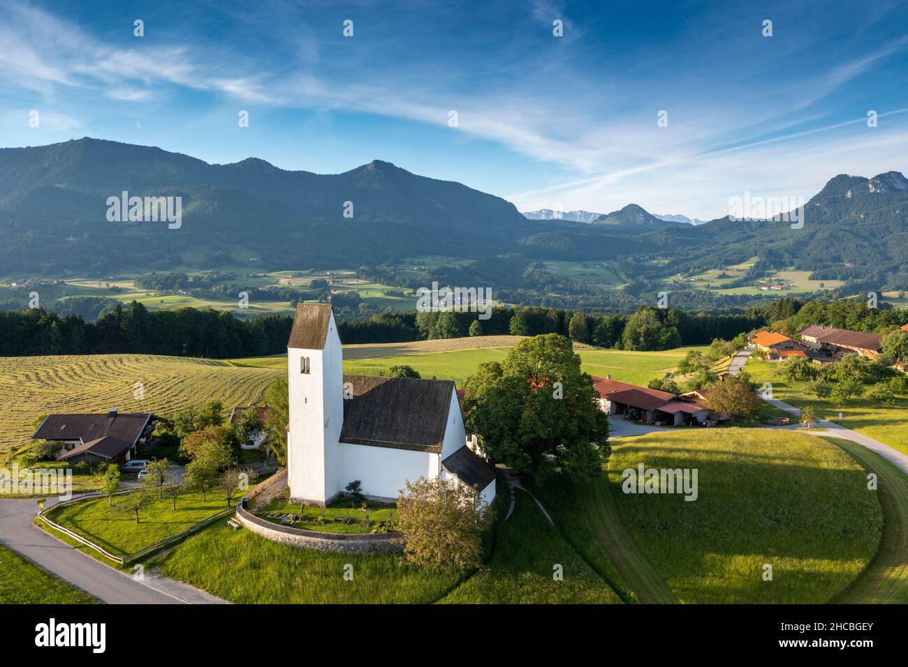 Germany, Bavaria, Samerberg, Drone view of small rural church in spring Stock Photo