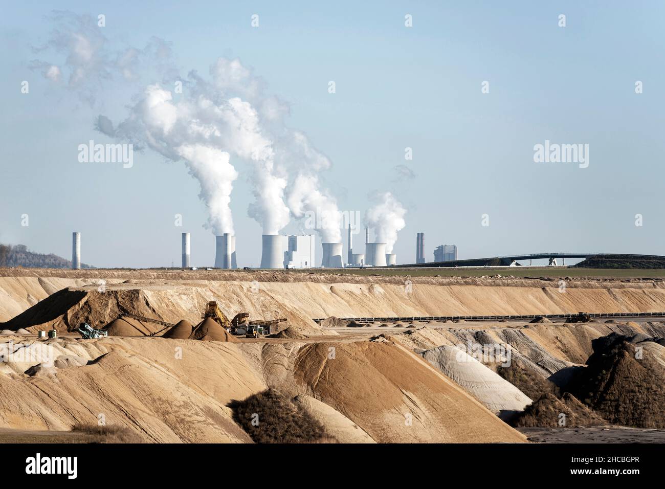 Industrial smoke stacks emitting pollution at Garzweiler Surface Mine, North Rhine-Westphalia, Germany Stock Photo