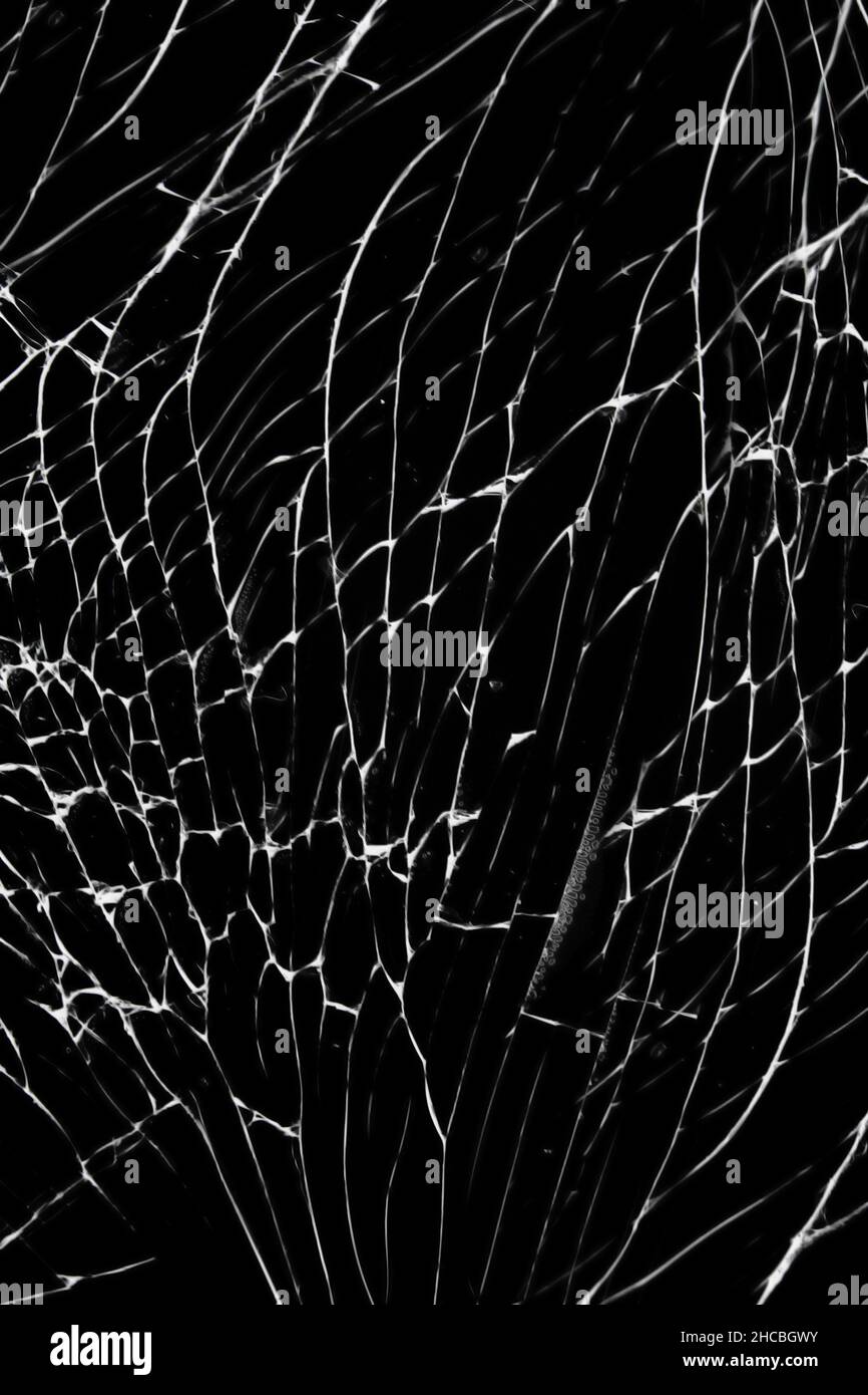 Cracked texture of broken protective glass of smartphone or tablet Stock Photo