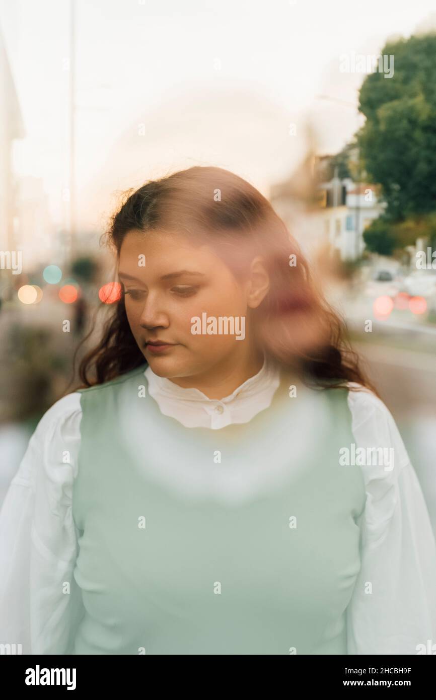 Double exposure of young plus size woman Stock Photo