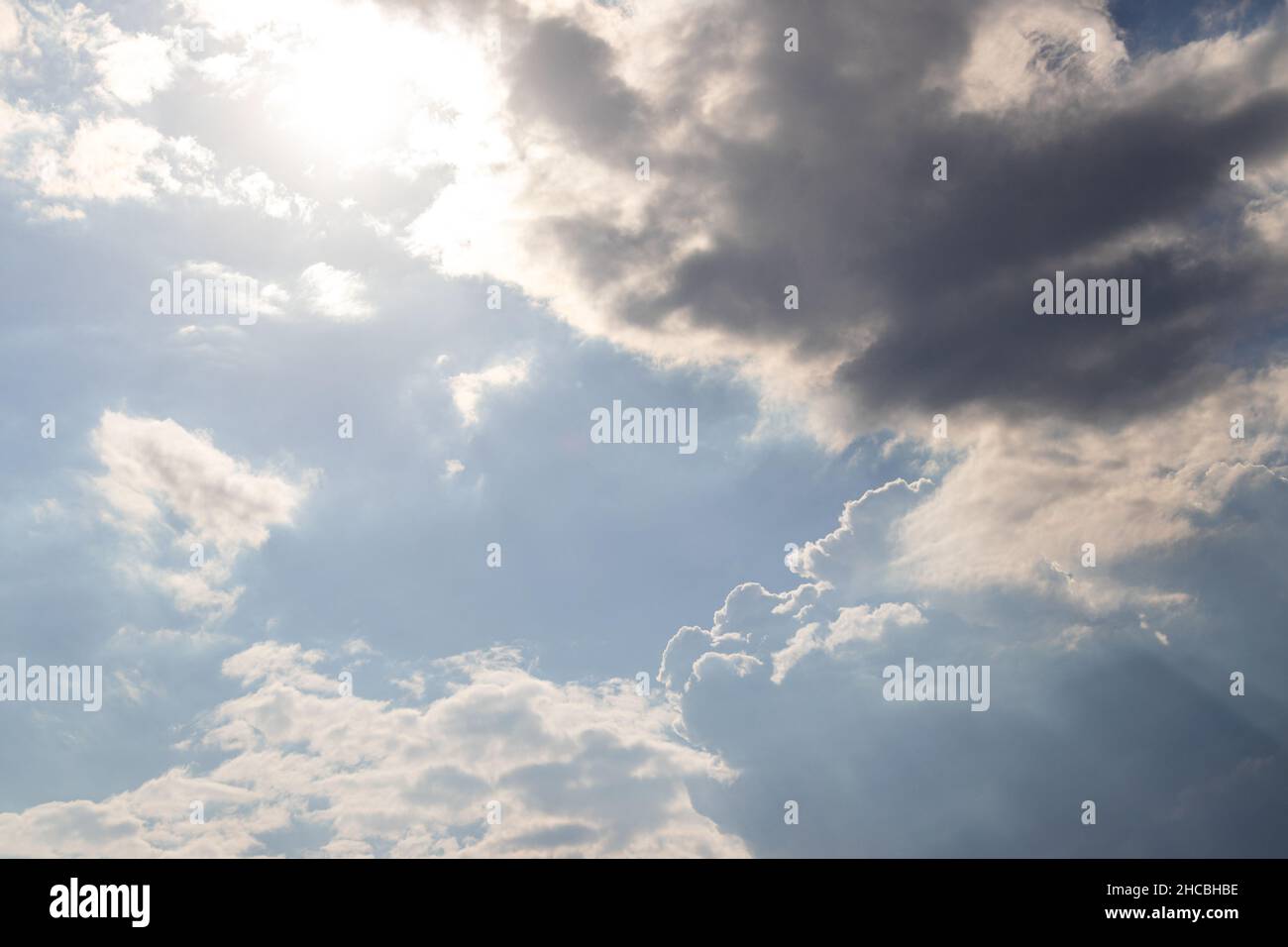 clouds on windy and sunny day on blue sky Stock Photo