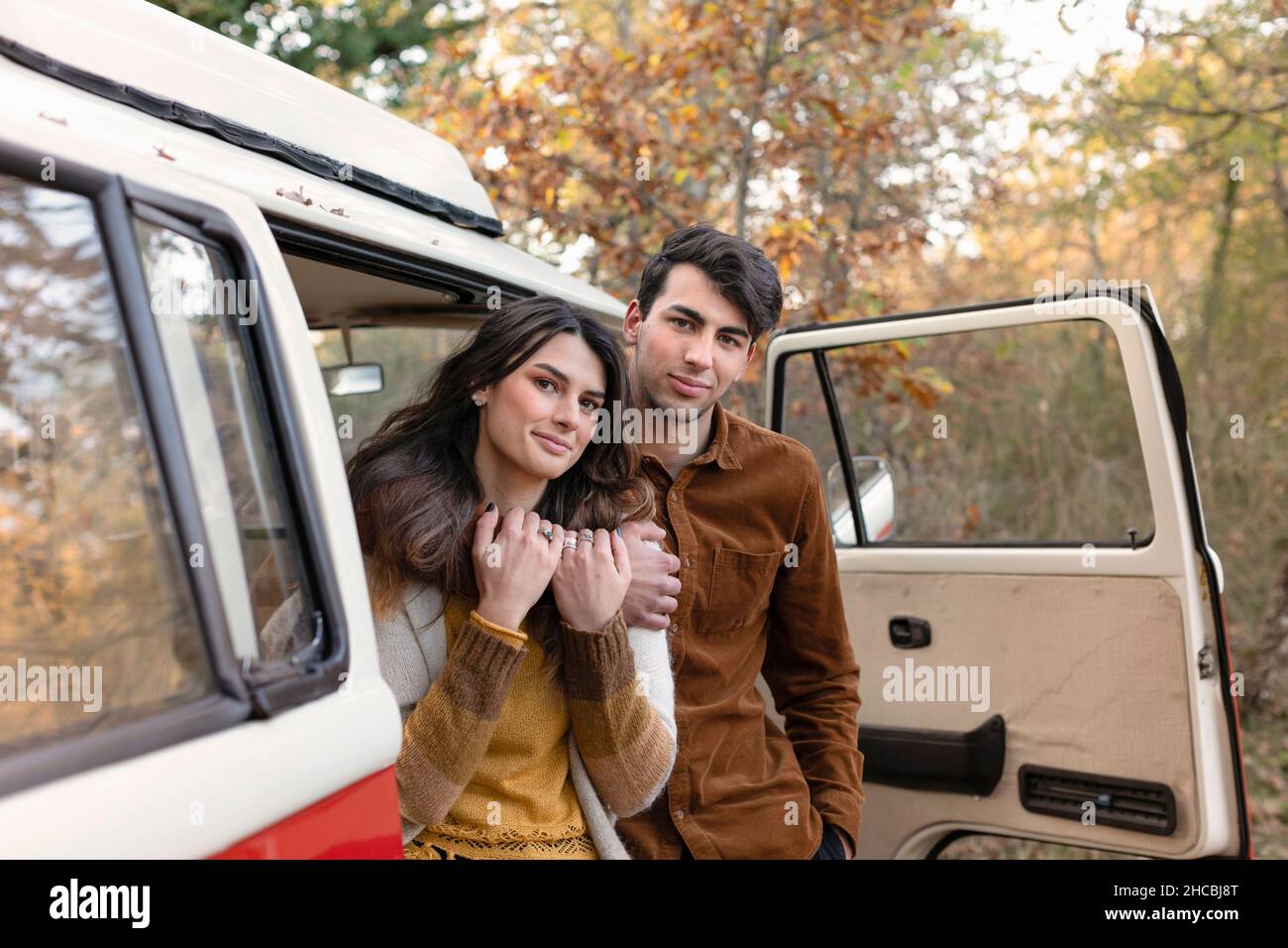 Young man embracing girlfriend hi-res stock photography and images - Alamy