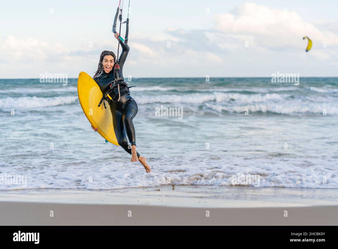 Woman kite surfing kite beach hi-res stock photography and images - Alamy