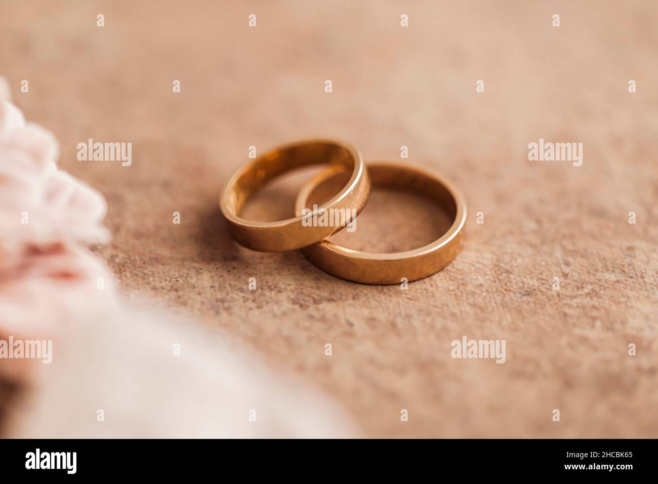 Studio shot of tray with engagement ring and golden wedding rings Stock Photo