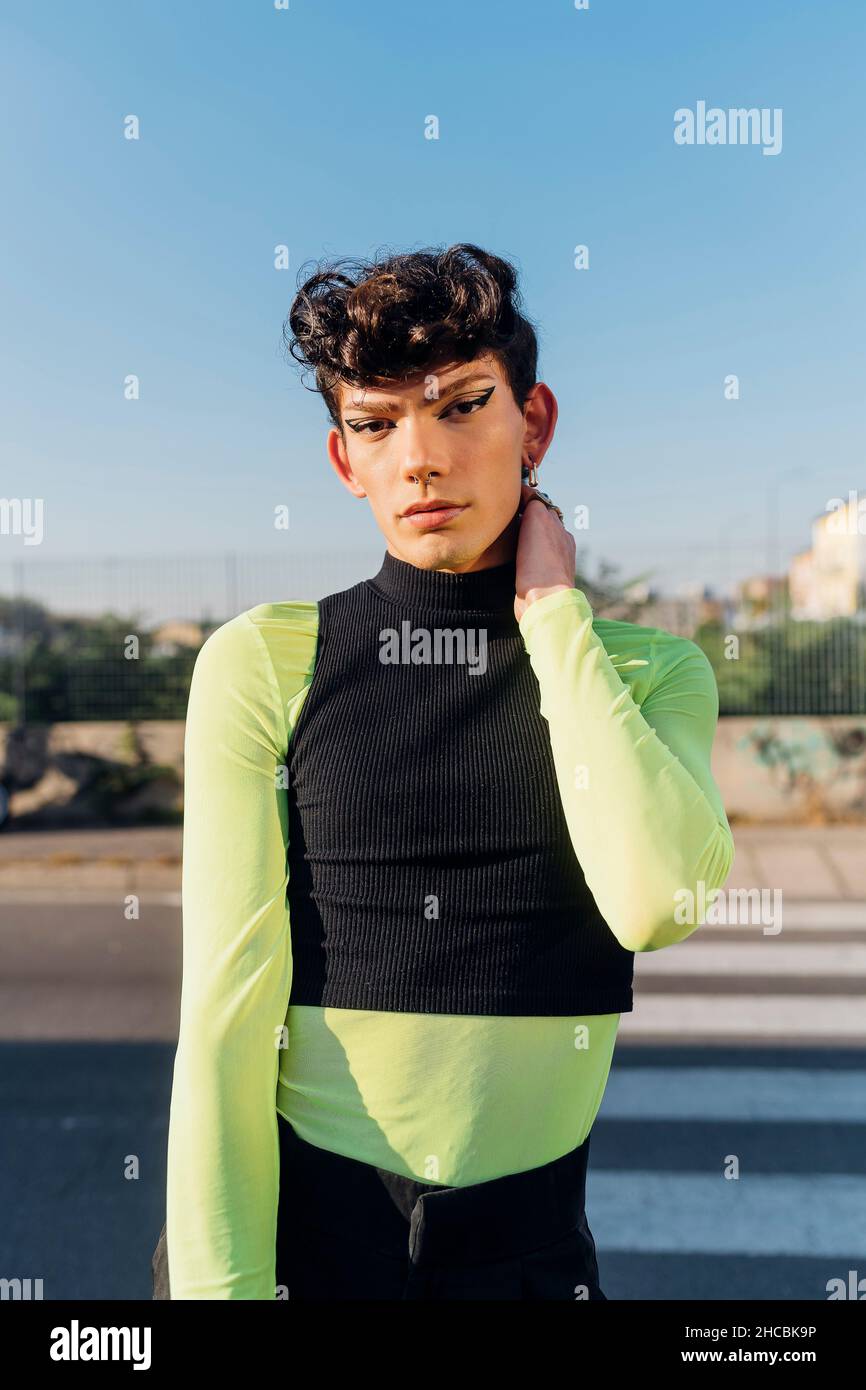 Young gay man standing on road Stock Photo