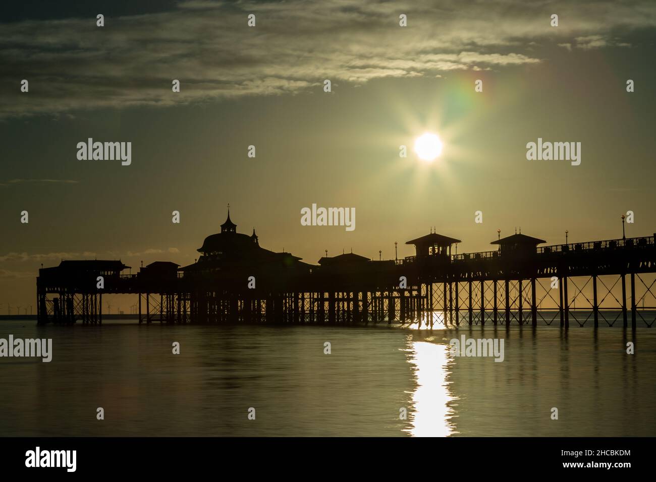 Pier at sunrise on Llandudno North Shore, North Wales Stock Photo