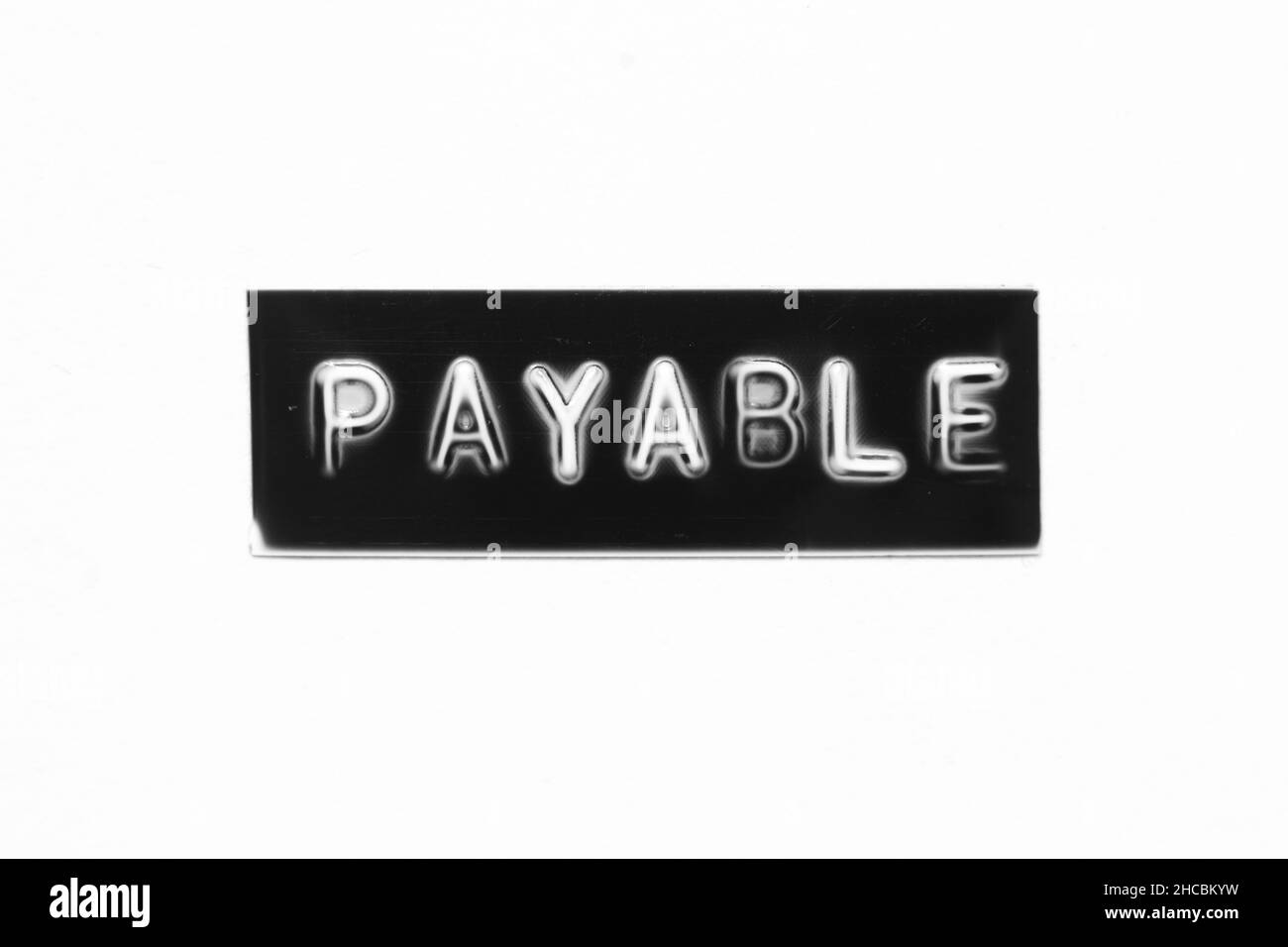 Payables Lettering Black color banner that have embossed letter with word payable on white ...