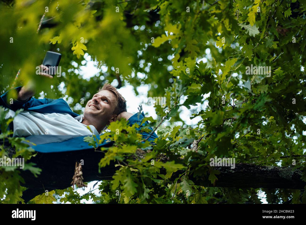 Business man hanging upside down hi-res stock photography and images ...