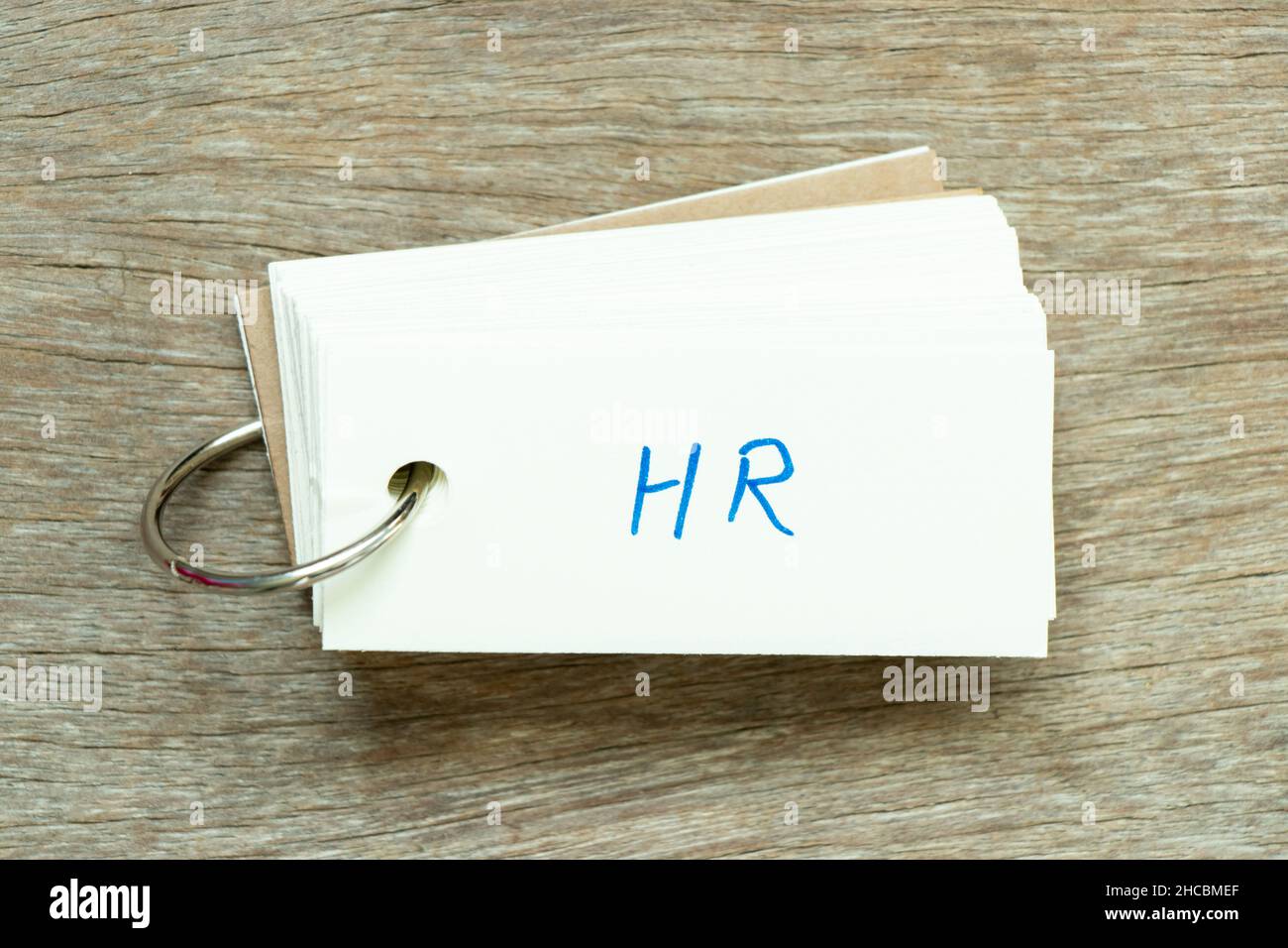 Flash card with handwriting word HR (Abbreviation of human resource) on