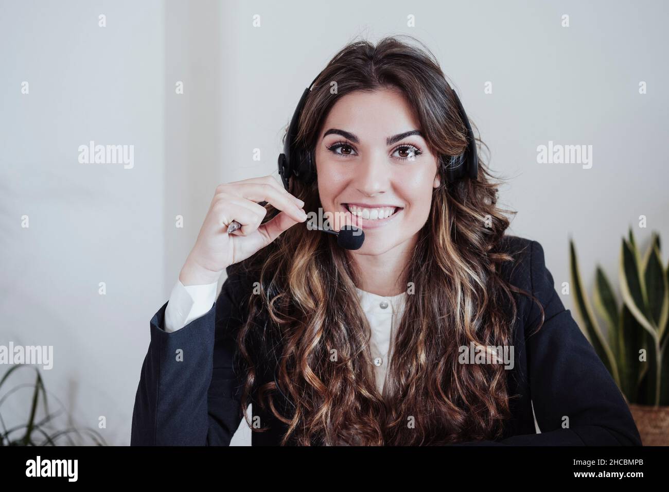 Customer service representative with headset at office Stock Photo