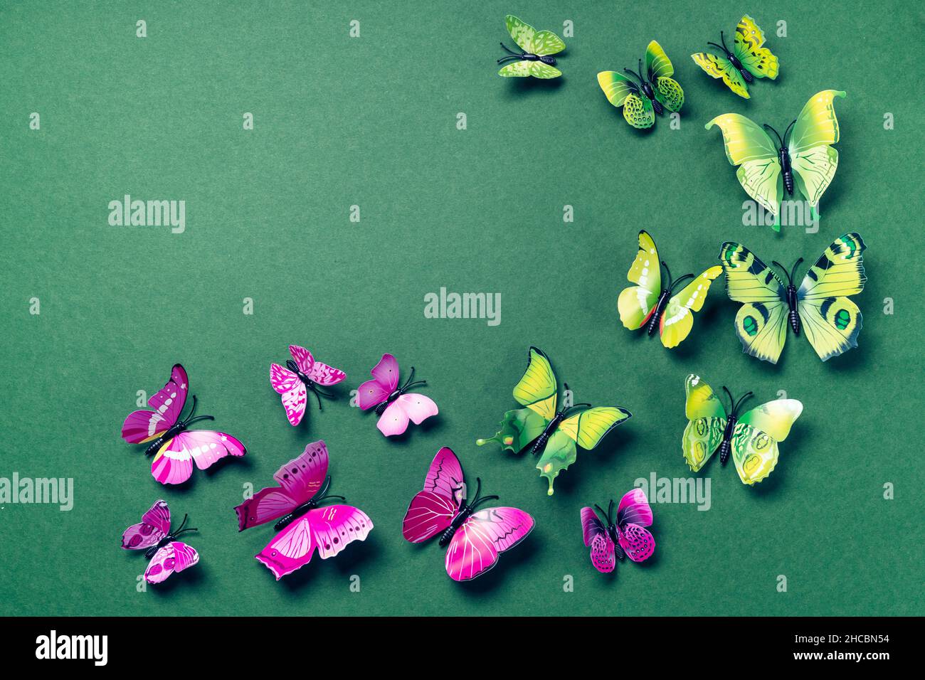 Abstract green background with butterflies Stock Photo - Alamy