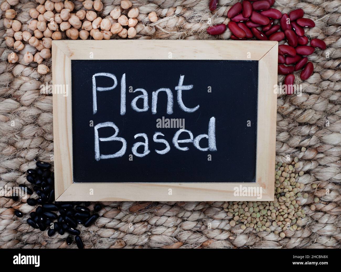 chalk board with plant based in writing with organic plant based protein Stock Photo