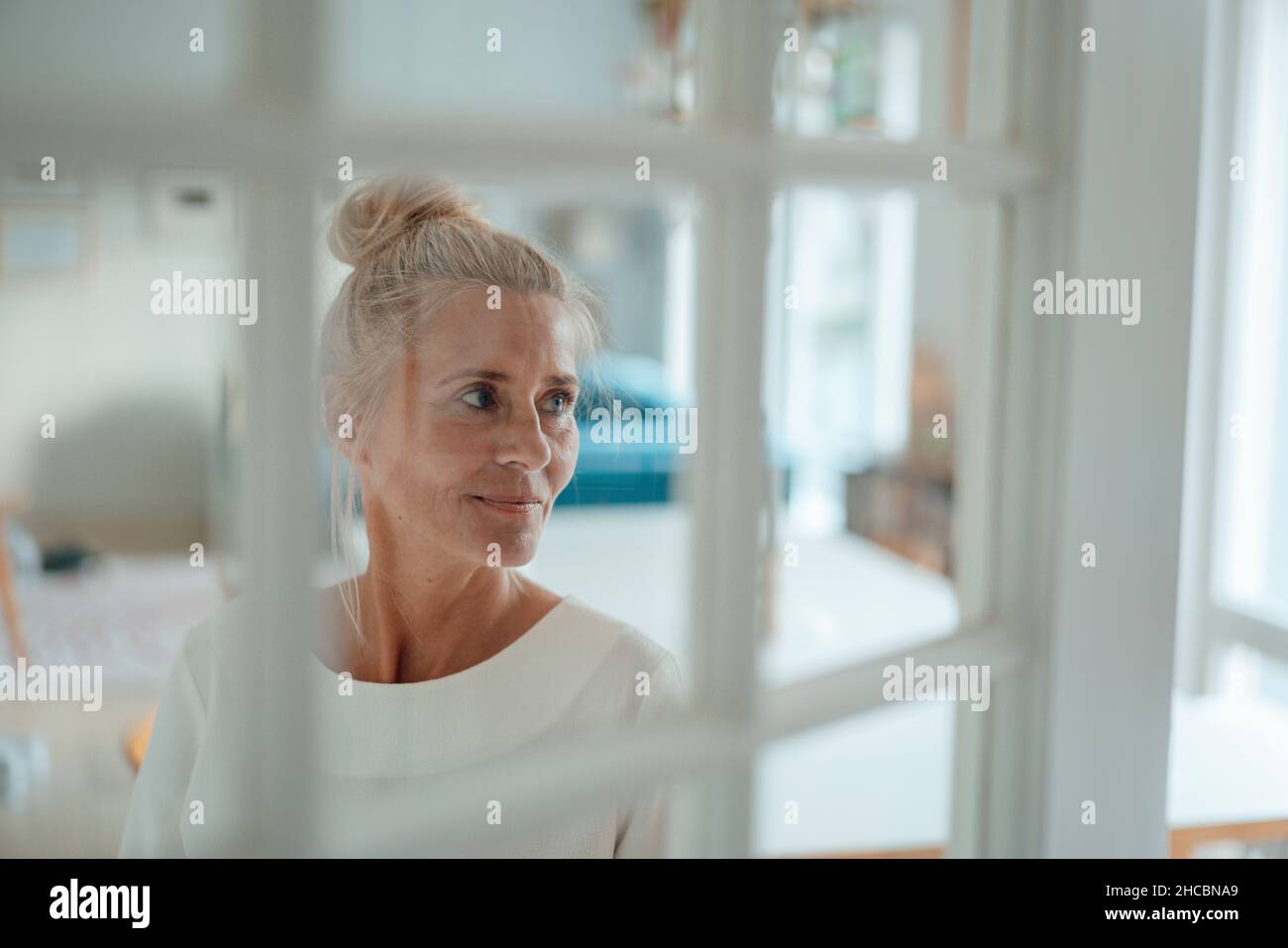 Man using tablet PC with woman at home Stock Photo