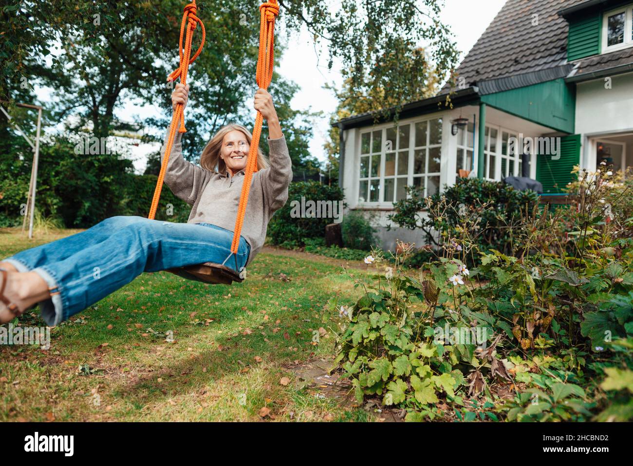 Swinging woman hi-res stock photography and images - Alamy