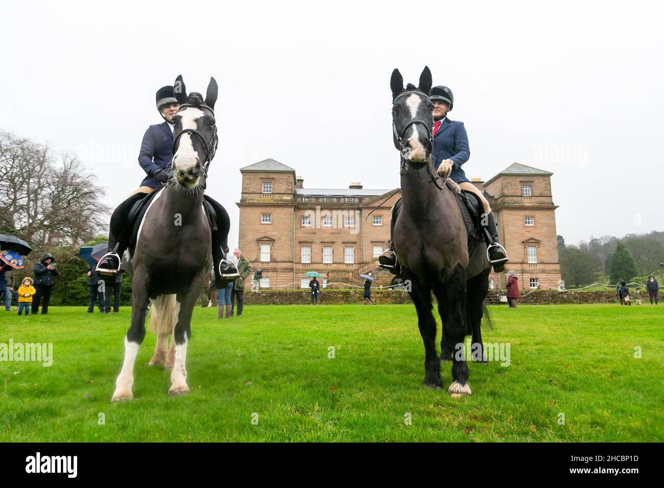 Hagley, Worcestershire, UK. 27th Dec, 2021. Hunt participants turn out in the rain for the first hunt at Hagley Hall since the Coronavirus pandemic. The Albrighton and Woodland Hunt meet annually at Hagley Hall in Worcestershire. Credit: Peter Lopeman/Alamy Live News Stock Photo