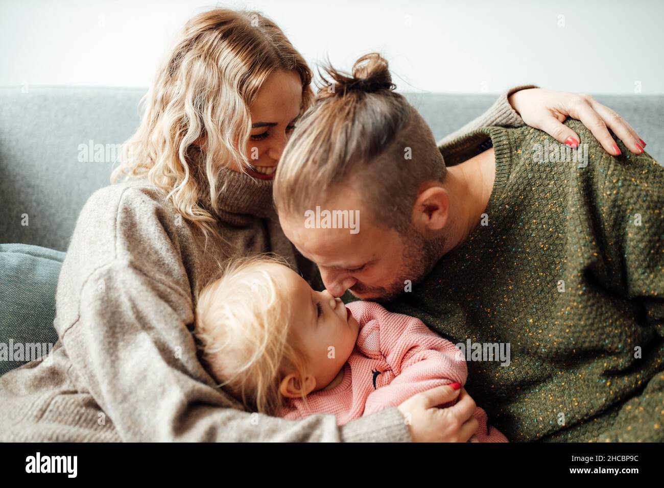 Happy family using tablet PC at home Stock Photo
