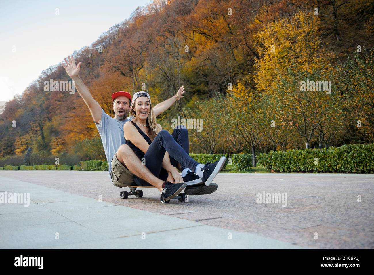 Man sitting behind woman hi-res stock photography and images - Alamy