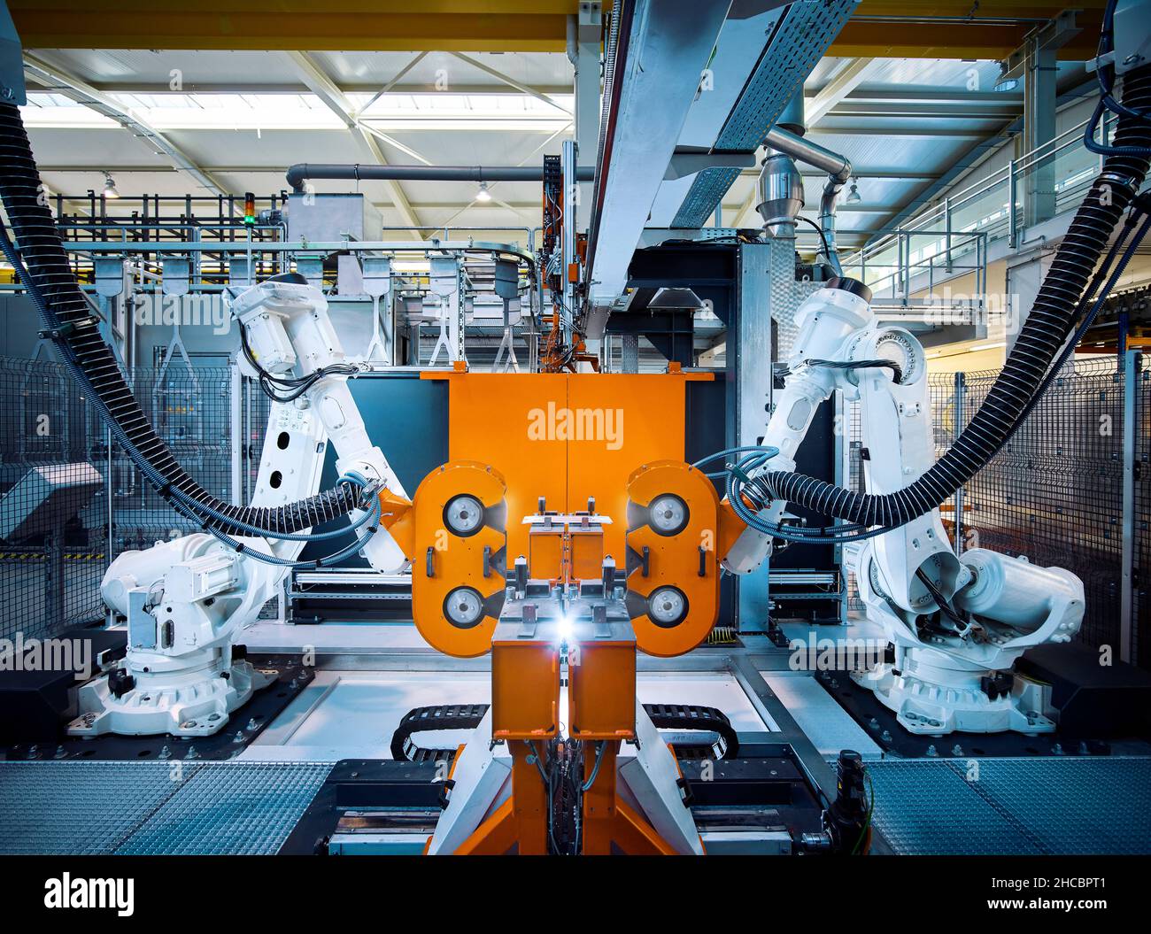 Robotic arms operating inside modern factory Stock Photo Alamy