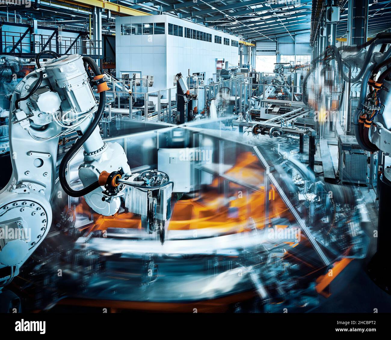 Robotic arms operating inside modern factory Stock Photo Alamy