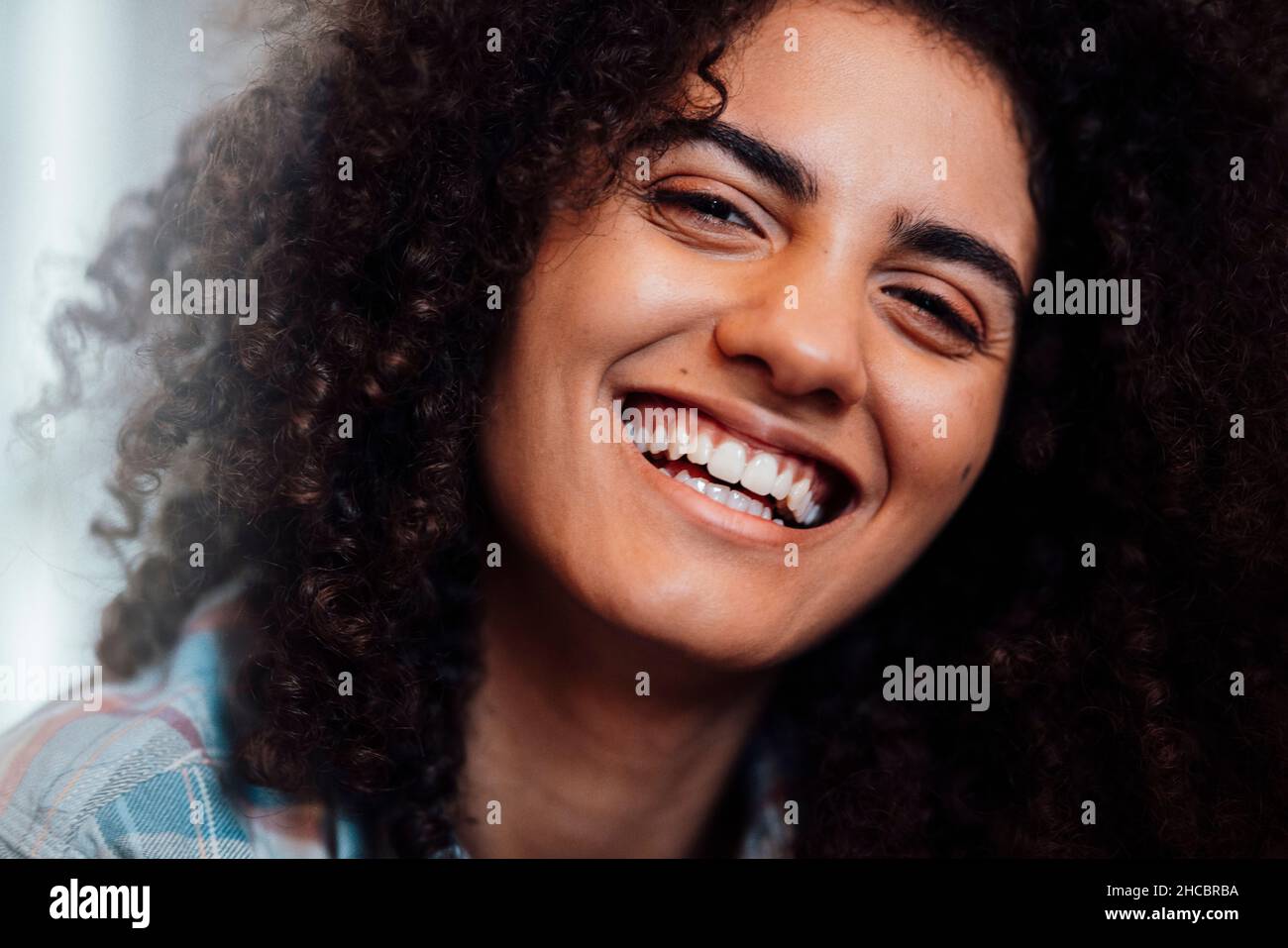 Cheerful woman with curly hair Stock Photo