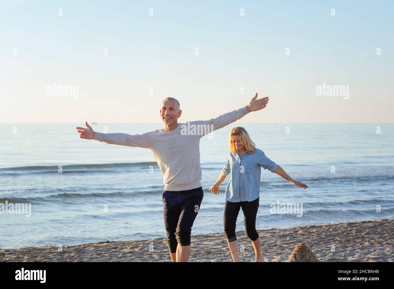 Carefree woman walking log beach hi-res stock photography and images ...